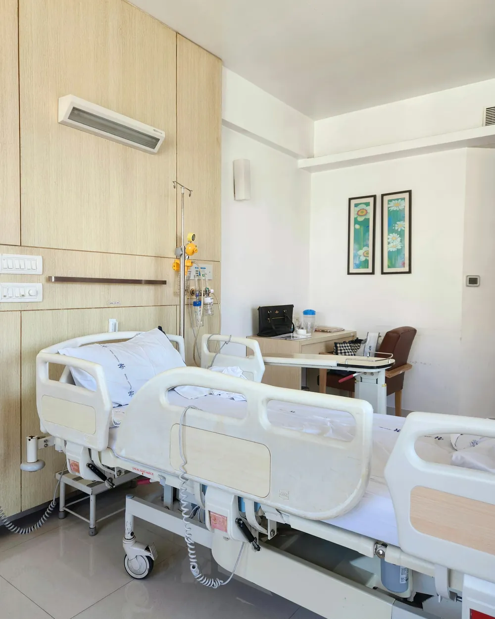 Hospital ward with beds and lockers