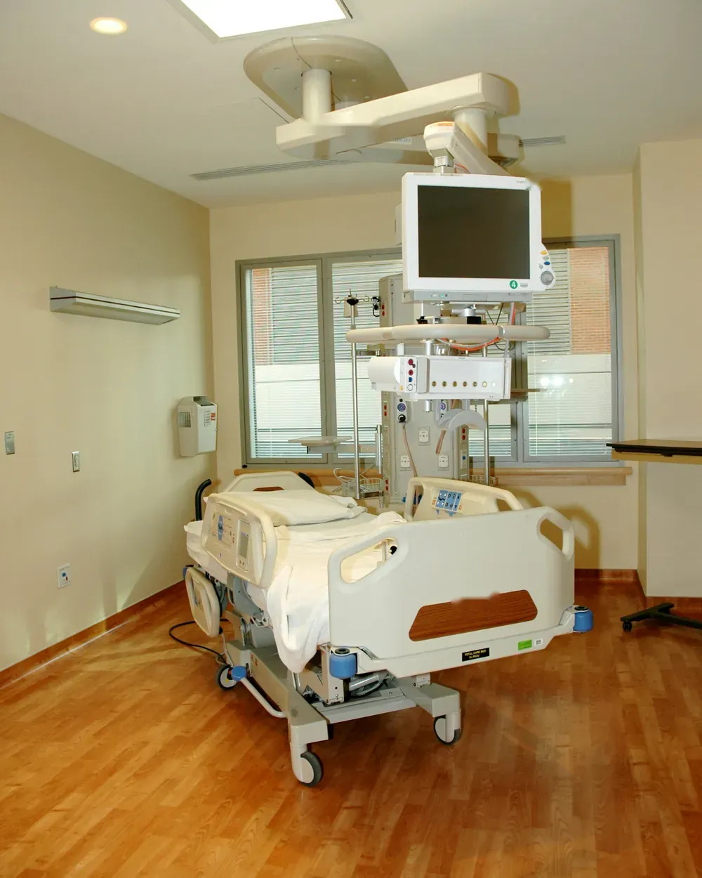 ICU bed space with patient monitor and services